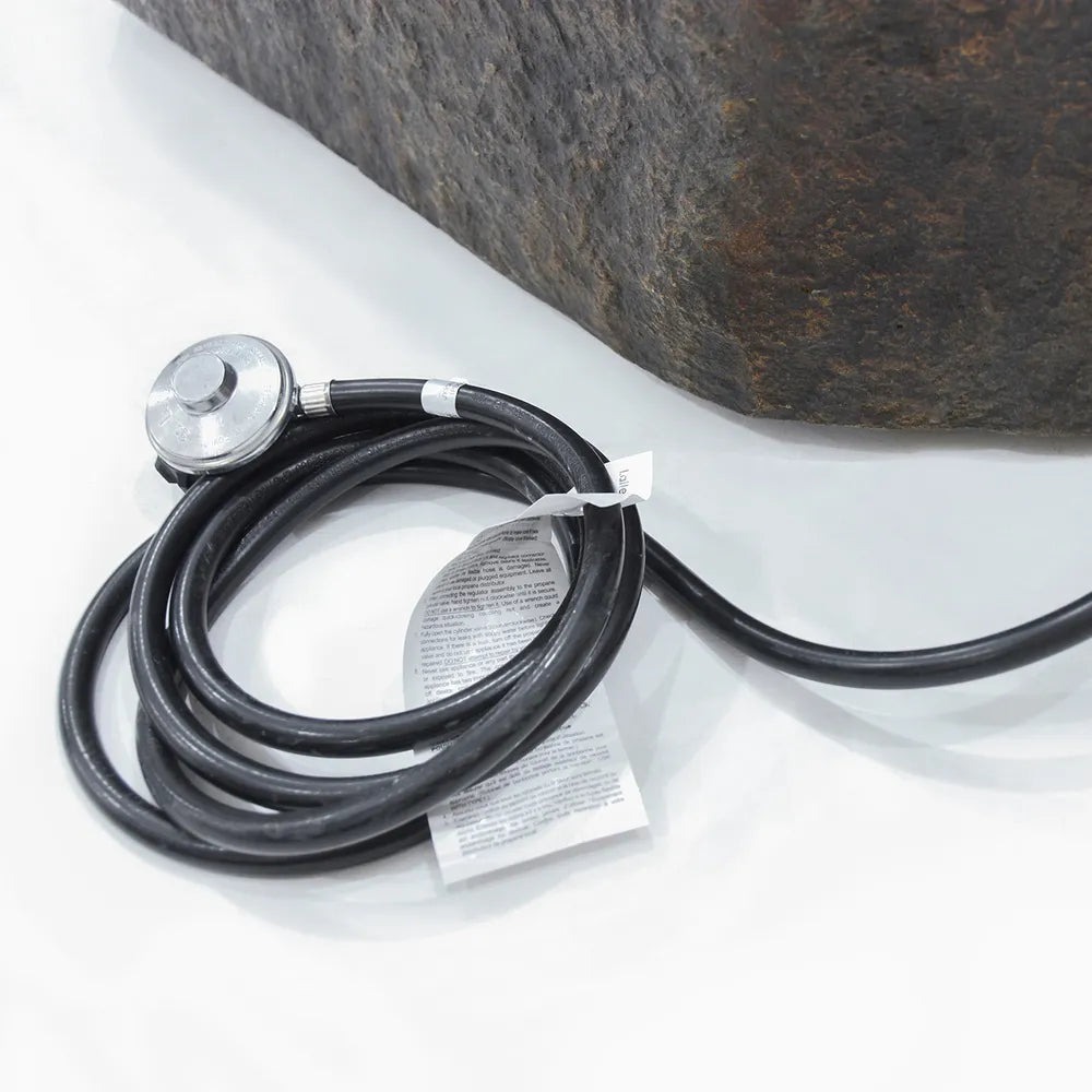 Elementi Columbia fire table gas connection kit including a high-pressure propane hose and regulator.