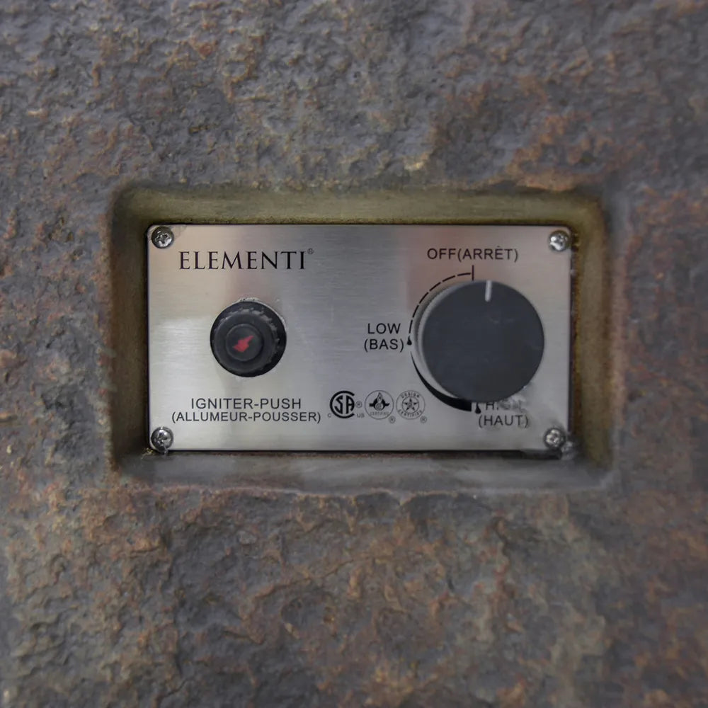 Close-up of the Elementi fire table control panel showing the electronic ignition button and flame adjustment knob.