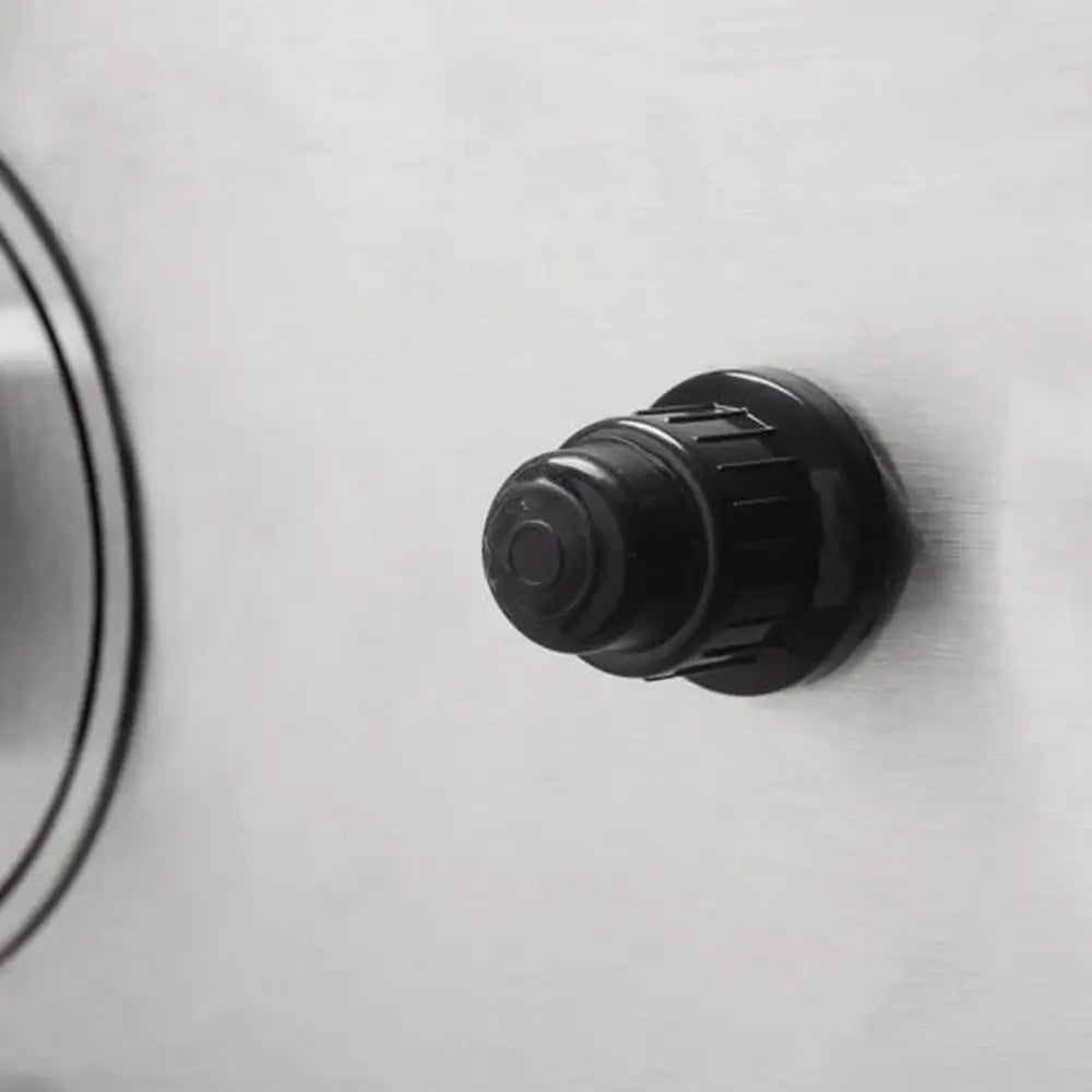 Close-up of ignition push button on Le Griddle gas griddle.