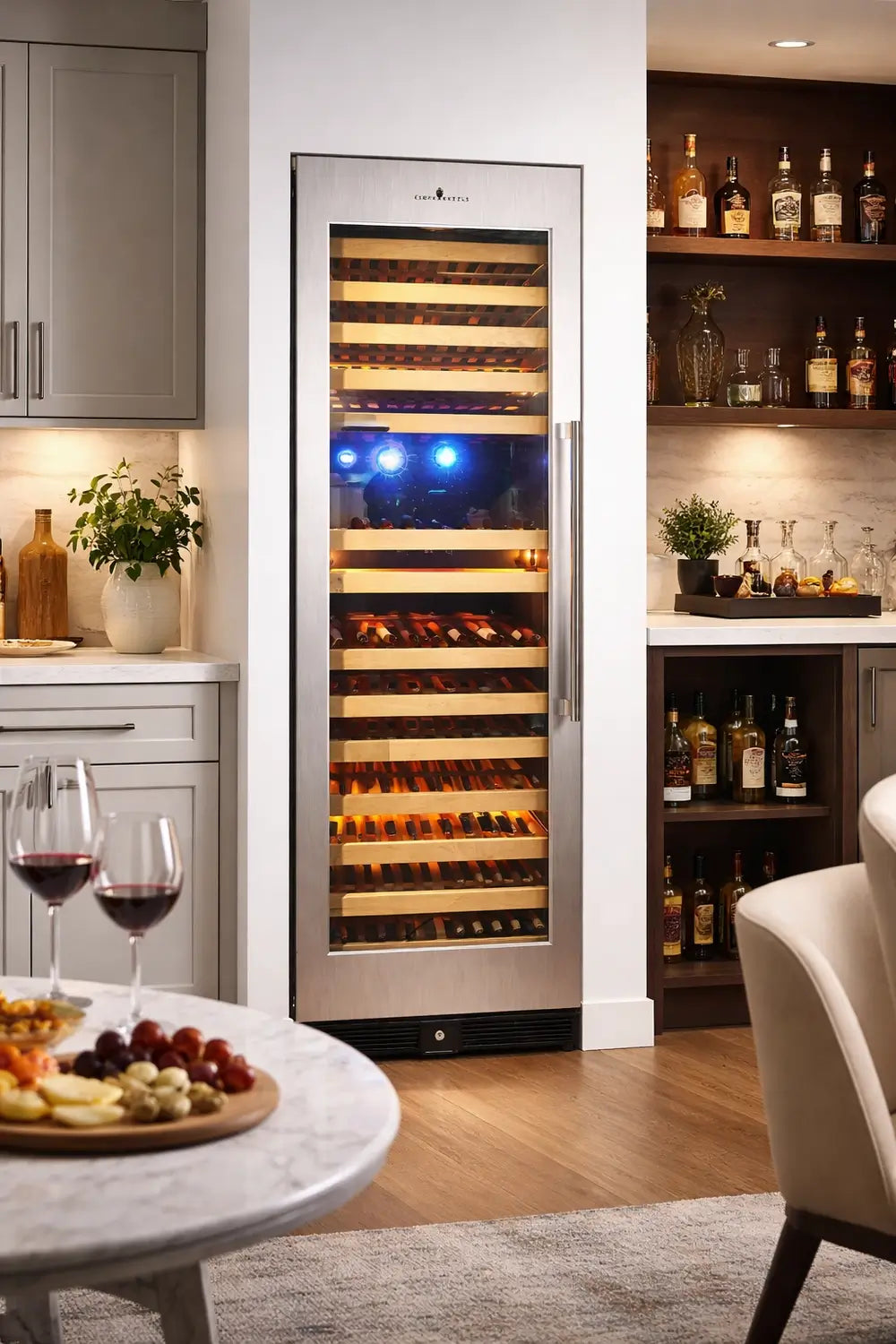 KingsBottle KBU170DX-SS large wine refrigerator built into a modern kitchen bar with stainless steel trim and glass door.