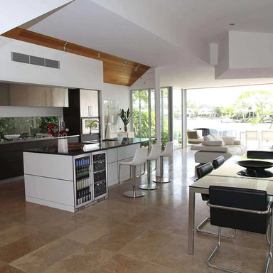 KingsBottle KBU28LRX beverage cooler integrated into a luxury kitchen island, illustrating its built-in application in a modern open-plan kitchen.