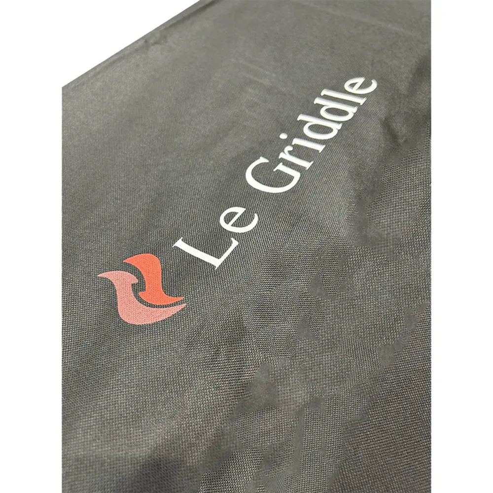 Close-up of Le Griddle black vinyl lid cover with logo