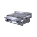 Angled view of Le Griddle Pro Series 75 gas griddle with front grease tray open