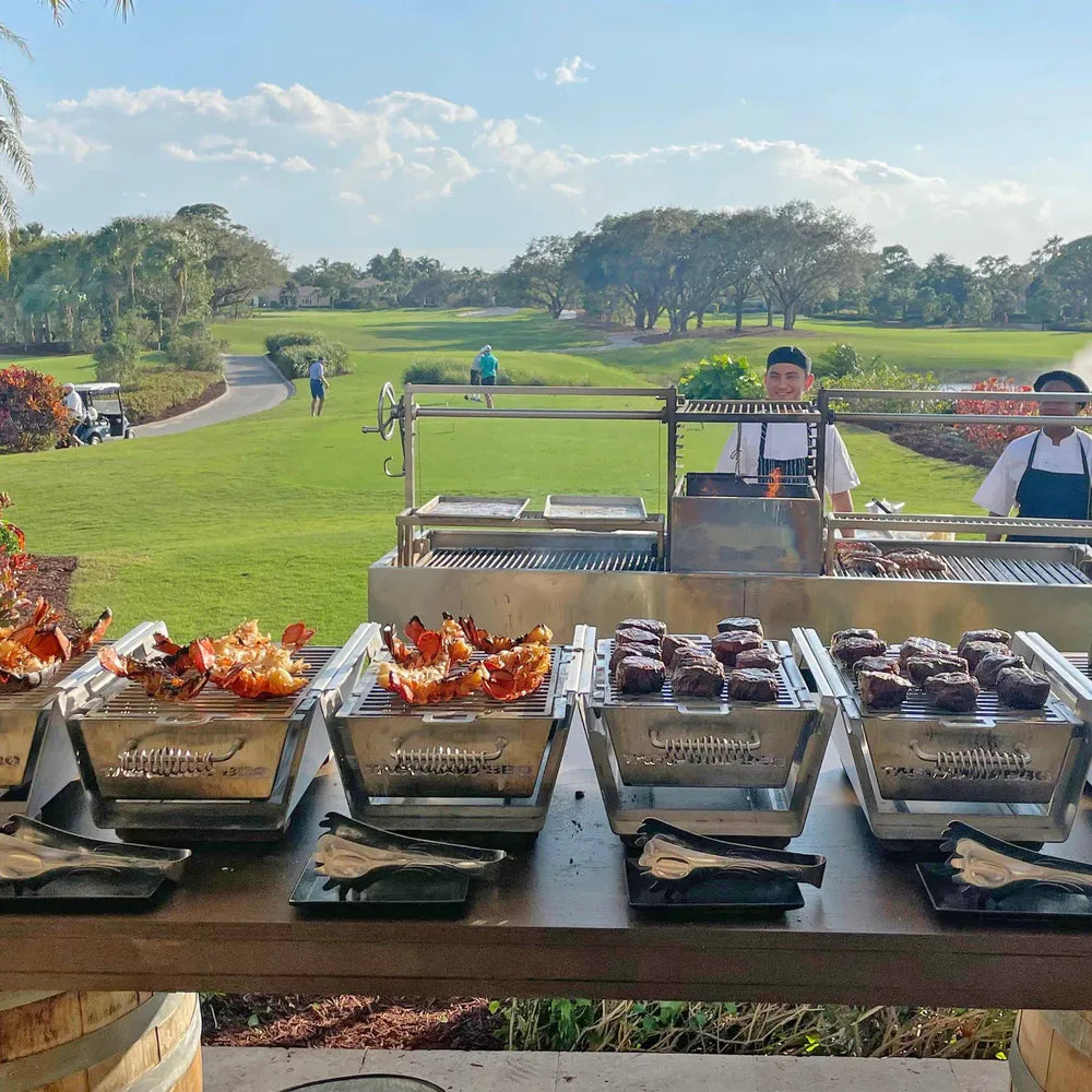 Tagwood BBQ24SS Double Santa Maria grill outdoor catering setup cooking lobster and steaks