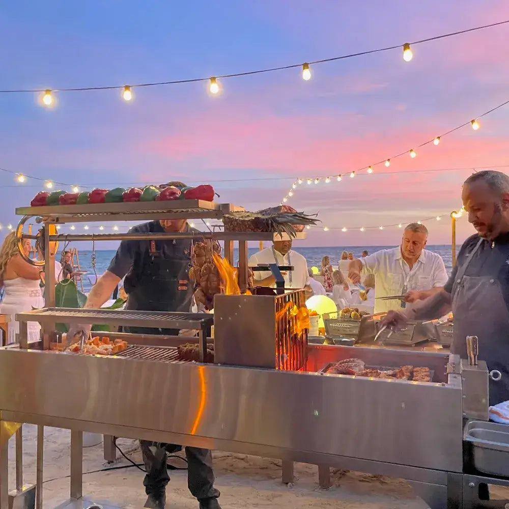 Tagwood BBQ06SS Santa Maria grill cooking at beachside barbecue event at sunset