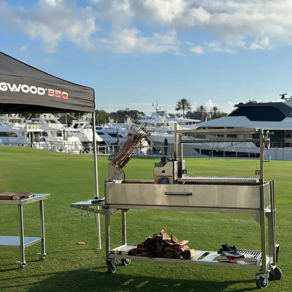 Tagwood BBQ06SS Santa Maria grill outdoor event setup with Tagwood canopy near marina