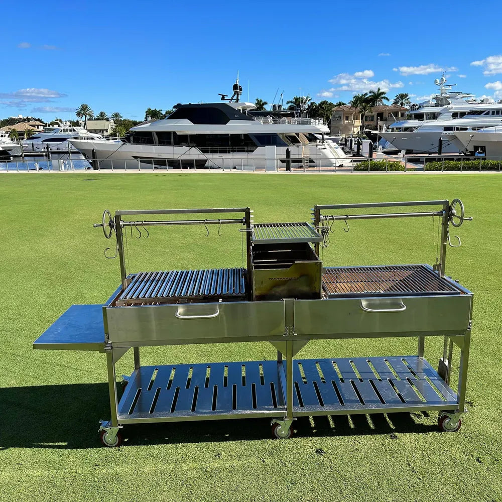 Tagwood BBQ24SS Double Santa Maria grill marina lawn setup with yachts in background