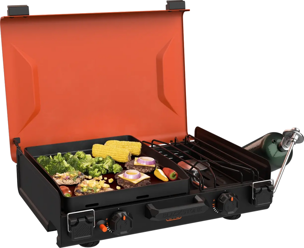 Top view of food cooking on 12x14 black griddle with active side burner