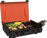 Top view of food cooking on 12x14 black griddle with active side burner