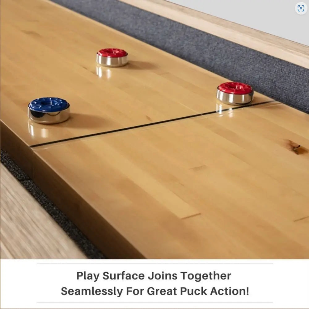 Close-up of the seamless center connection on the Freetime Fun Rockford 2-piece shuffleboard table play surface with pucks.