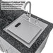 Close-up of Sunstone outdoor sink with a white ABS cutting board installed, showing the slit opening and 2-inch clearance for food protection.