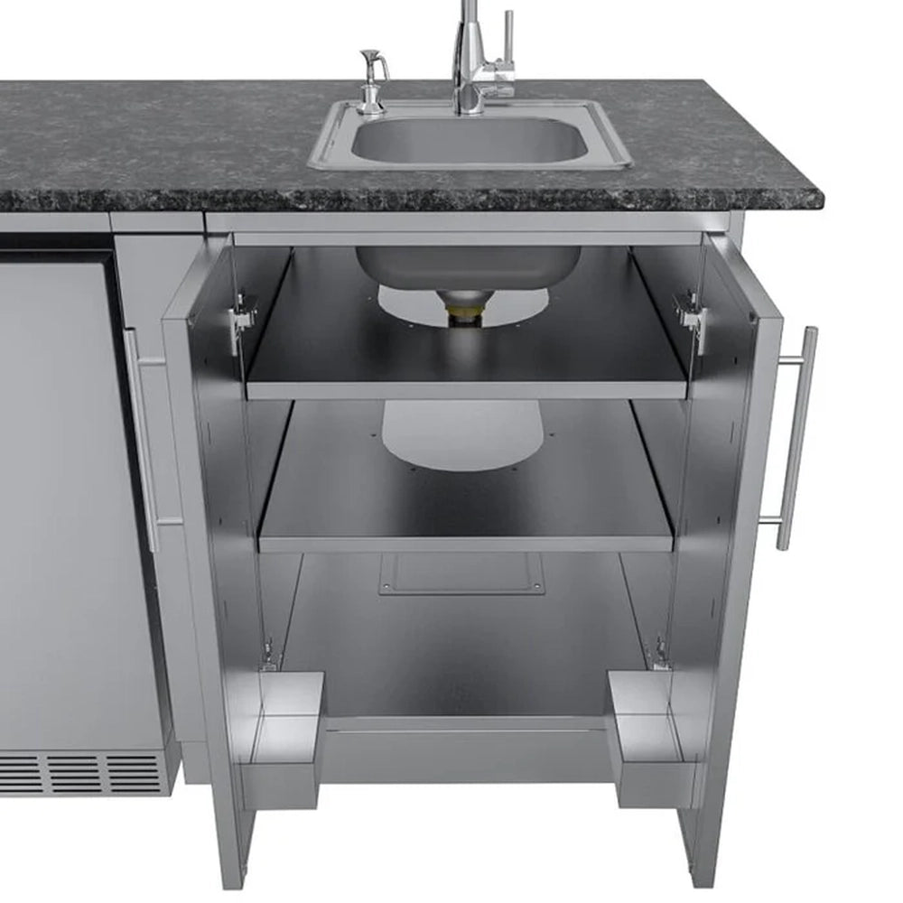 Interior view of Sunstone stainless steel sink cabinet featuring two storage shelves and cutouts for plumbing and drain access.