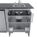 Interior view of Sunstone stainless steel sink cabinet featuring two storage shelves and cutouts for plumbing and drain access.