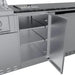 Open single door stainless steel storage cabinet for the Brazos outdoor kitchen island showing adjustable interior shelving and 304-grade construction.