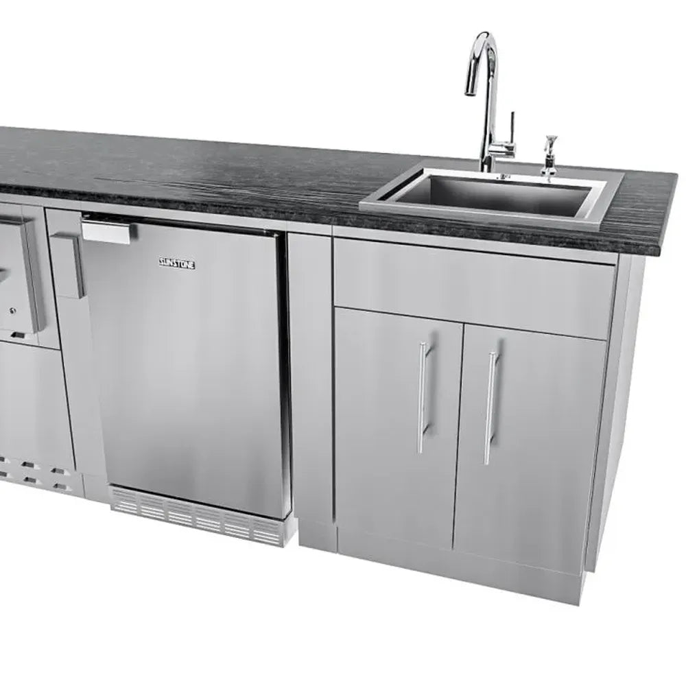 Sunstone SCPFRENCHQUARTER13.7 French Quarter Island close-up of sink base and under-counter refrigerator with black granite countertop and faucet.