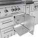 Outdoor grill cabinet detail showing a stainless steel pull-out tray for easy access to tools and accessories under a multi-burner gas grill.