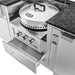 Close-up of a Sunstone Power Cirque burner with a large stainless steel cover and temperature gauge, shown next to a stone countertop with a GFCI outlet.