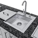 Sunstone SCPMAGNOLIA10 Magnolia ADA outdoor kitchen island stainless steel sink with high-arc faucet and soap dispenser on granite countertop.