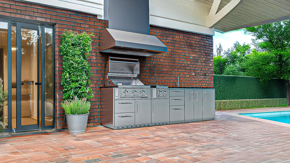 Sunstone SCPMAGNOLIA10 Magnolia ADA Kitchen Island 10 ft outdoor kitchen setup by brick house and pool with vent hood, stainless grill, side burner, and sink.
