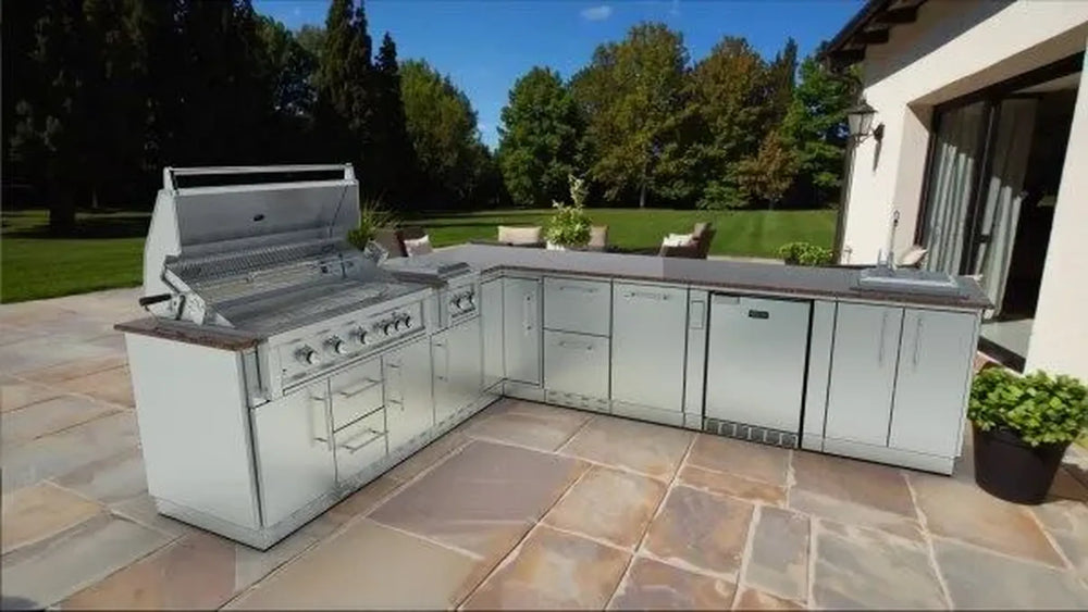 Sunstone SCPRANCHER8.10BY11 Rancher L-shaped outdoor kitchen island with built-in gas grill, sink, and stainless steel cabinets.