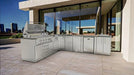 Modern patio installation of Sunstone SCPRANCHER8.10BY11 Rancher L-shaped island with gas grill, sink, and stainless outdoor cabinets.