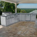 Sunstone Savanna 16ft angled outdoor kitchen island installed on a luxury stone patio under a covered gazebo.