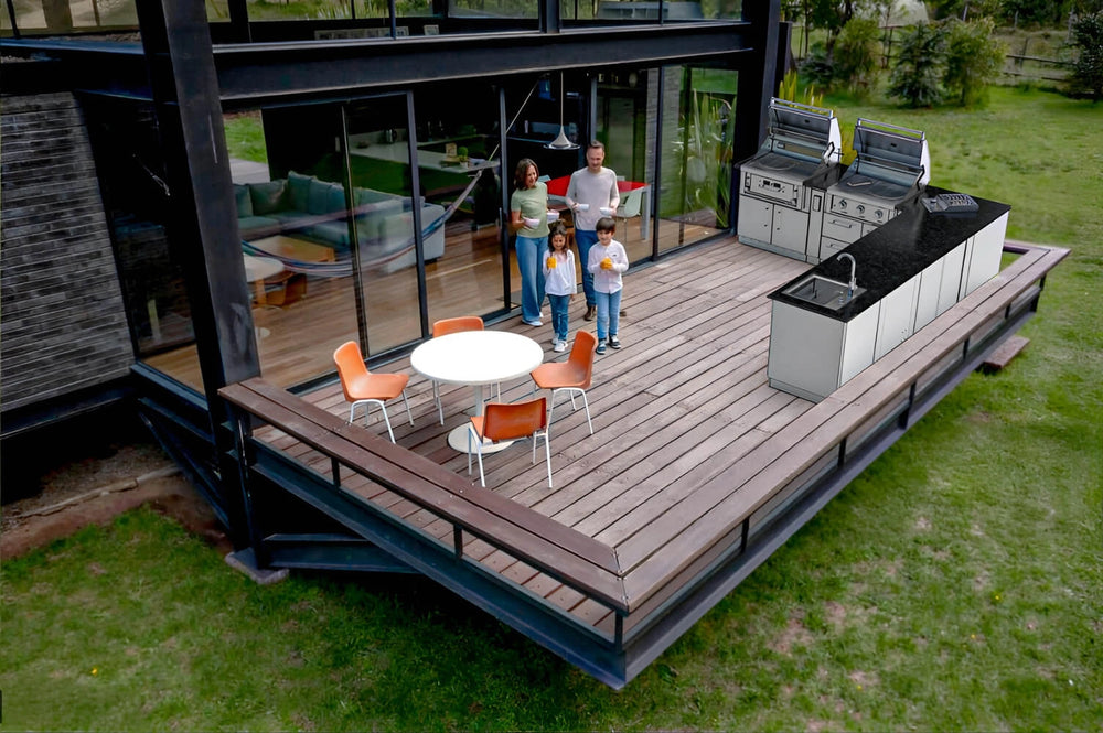 Sunstone SCPTXTANGO19 Texas Tango Outdoor Kitchen Island on large backyard deck with family nearby, featuring dual grills, sink, and extended prep counter.