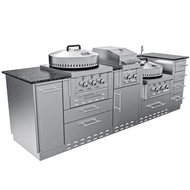 Three-quarter perspective product photograph of the complete 9-foot Sunstone TexCajun outdoor kitchen island, highlighting its deep stainless steel cabinets and integrated appliances with a dark granite countertop against a white background.