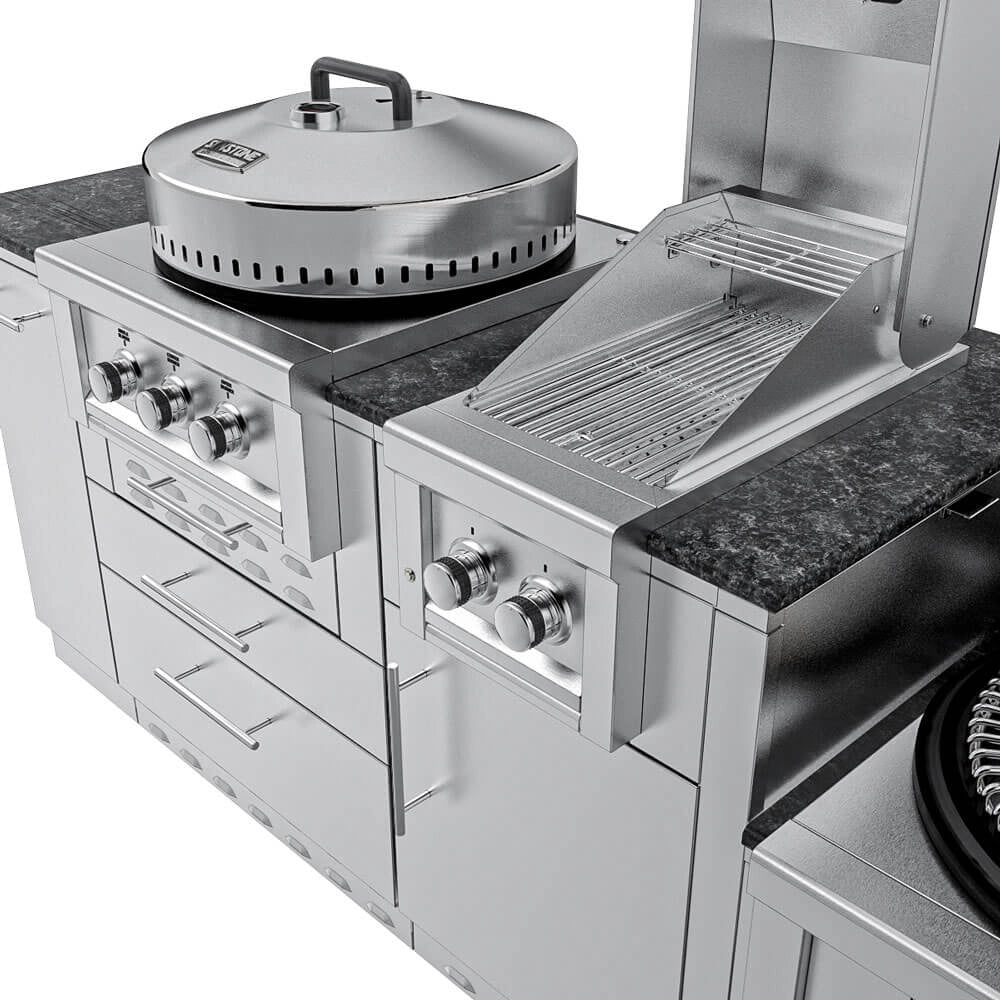Perspective shot of the Sunstone TexCajun outdoor kitchen showing the granite countertop, open main grill hood revealing cooking grates, covered power burner, and stainless steel cabinets.