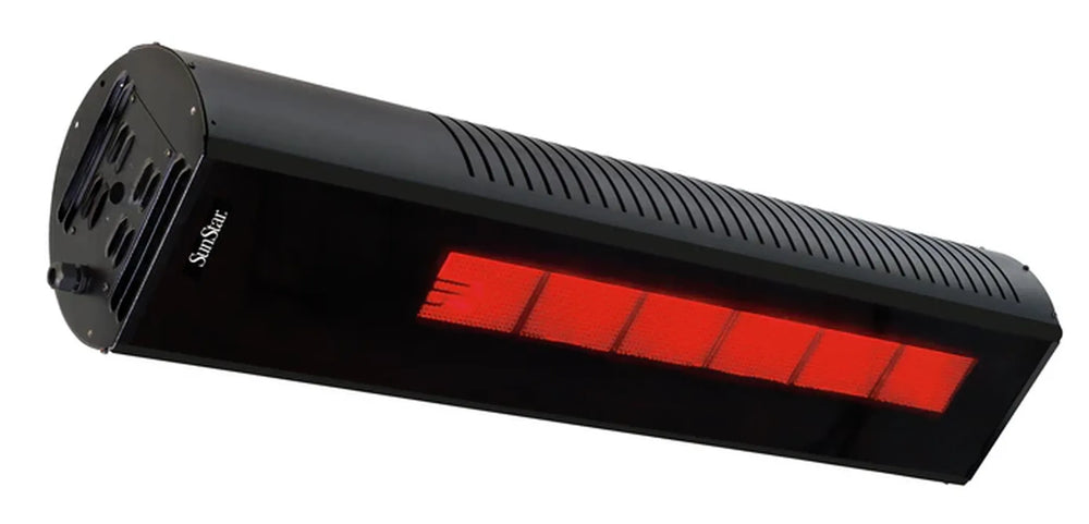 The soft, tinted glow of a SunStar SGL1560 glass heater providing ambient infrared heat on a modern terrace at night.