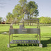 Tagwood BBQ26SS XL Santa Maria grill side view on grass showing adjustable height crank system