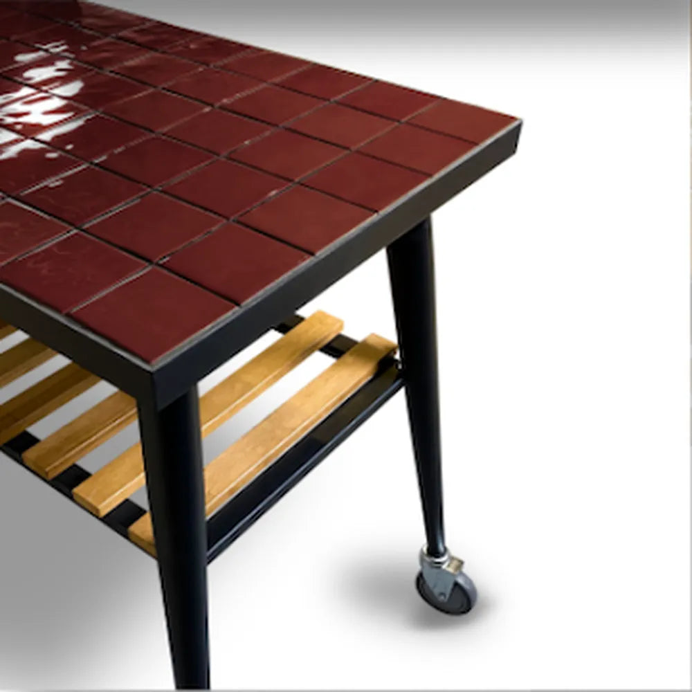WPPO Infinity 103cm side table with glossy red tile top, black frame, caster wheel, and lower wood storage shelf.