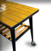 WPPO Infinity 75cm side table with glossy yellow tile top, black metal legs, caster wheel, and wood slat shelf.