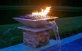 Travertine TessaRai Square Fire/Water Bowl Kit with blue fire glass, flames and waterfall spillway at night