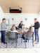 Sleek black SunStar SGL1560 glass-faced heater blending seamlessly into a modern ceiling patio design.