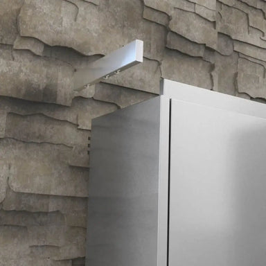 Side view of Sunstone SWC12ECR crown molding end panel installed on a 304 stainless steel upper wall cabinet.