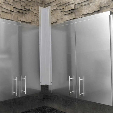 Close-up of Sunstone SWC3SP90 corner spacer panel installed between two stainless steel wall cabinets against a stone backsplash.