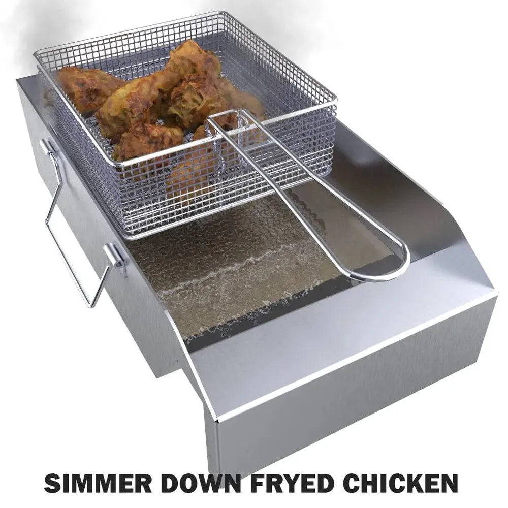 Wire fryer basket with fried chicken draining above hot oil in Sunstone stainless deep fryer insert.