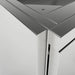 Close-up architectural detail of a Sunstone SCC27EP 27-inch stainless steel universal end panel showing the precision mitered corner and seamless fit against an outdoor kitchen cabinet.