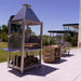Tagwood BBQ BBQ02SS Santa Maria grill angled view with prep cart and wood storage