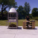 Tagwood BBQ BBQ02SS Santa Maria grill with prep station and hanging tools outdoors