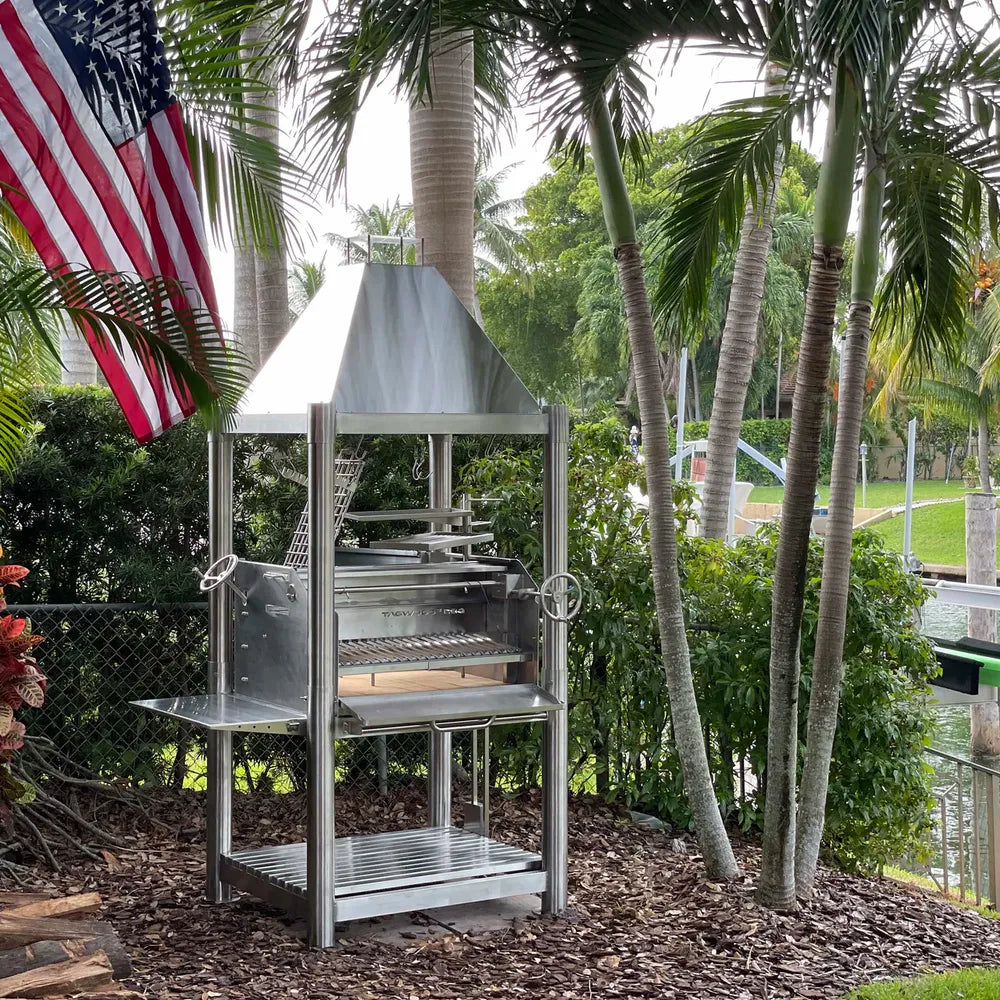 Tagwood BBQ BBQ02SS SS304 grill by waterfront patio with American flag backdrop