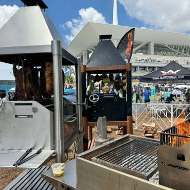 Tagwood BBQ BBQ02SS Santa Maria Grill SS304 at outdoor BBQ festival with open fire cooking