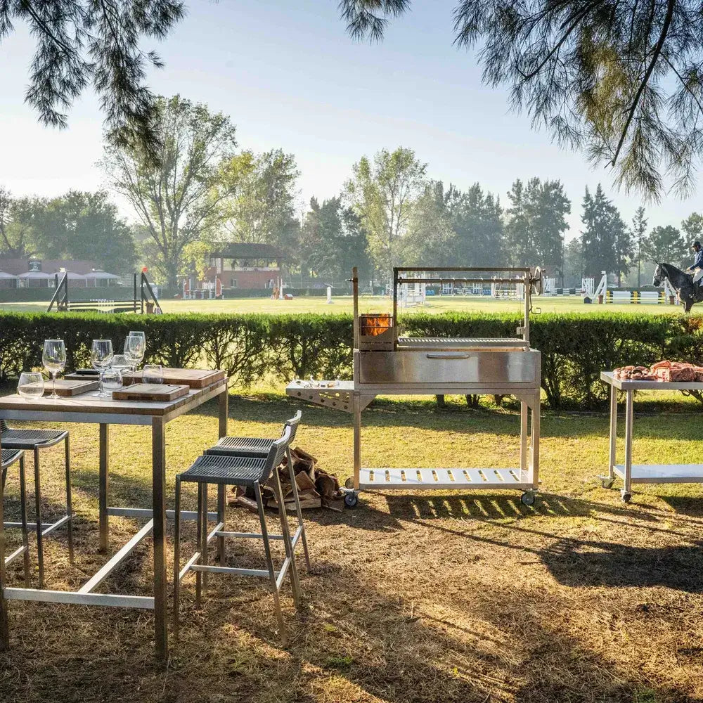Tagwood BBQ03SS Santa Maria grill outdoor dining setup beside polo field
