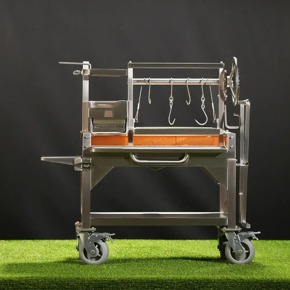 Tagwood BBQ03SS Mini Santa Maria grill front view with firebrick base and hanging meat hooks