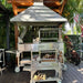 Tagwood BBQ03SS Mini Santa Maria grill and large Tagwood grill in outdoor BBQ kitchen under hood