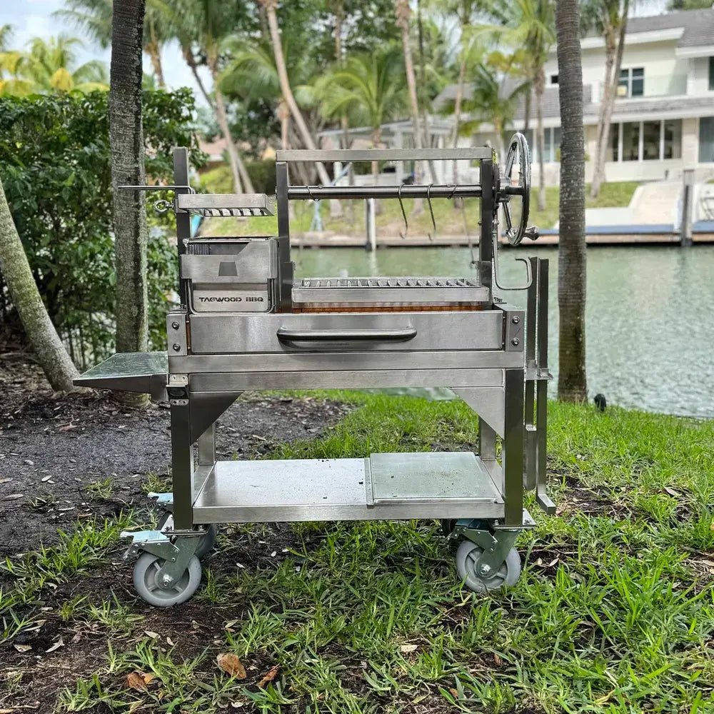 Tagwood BBQ03SS Mini Santa Maria grill stainless steel cart setup by waterfront backyard