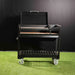 Tagwood BBQ18SI Argentine charcoal grill front view on wheeled cart