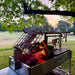 Tagwood BBQ26SS XL Santa Maria grill firebox charcoal basket with wood burning flames close up