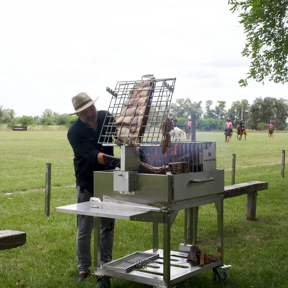 Tagwood BBQ33SS Argentine clamp grill chef grilling ribs using vertical clamp grate outdoors